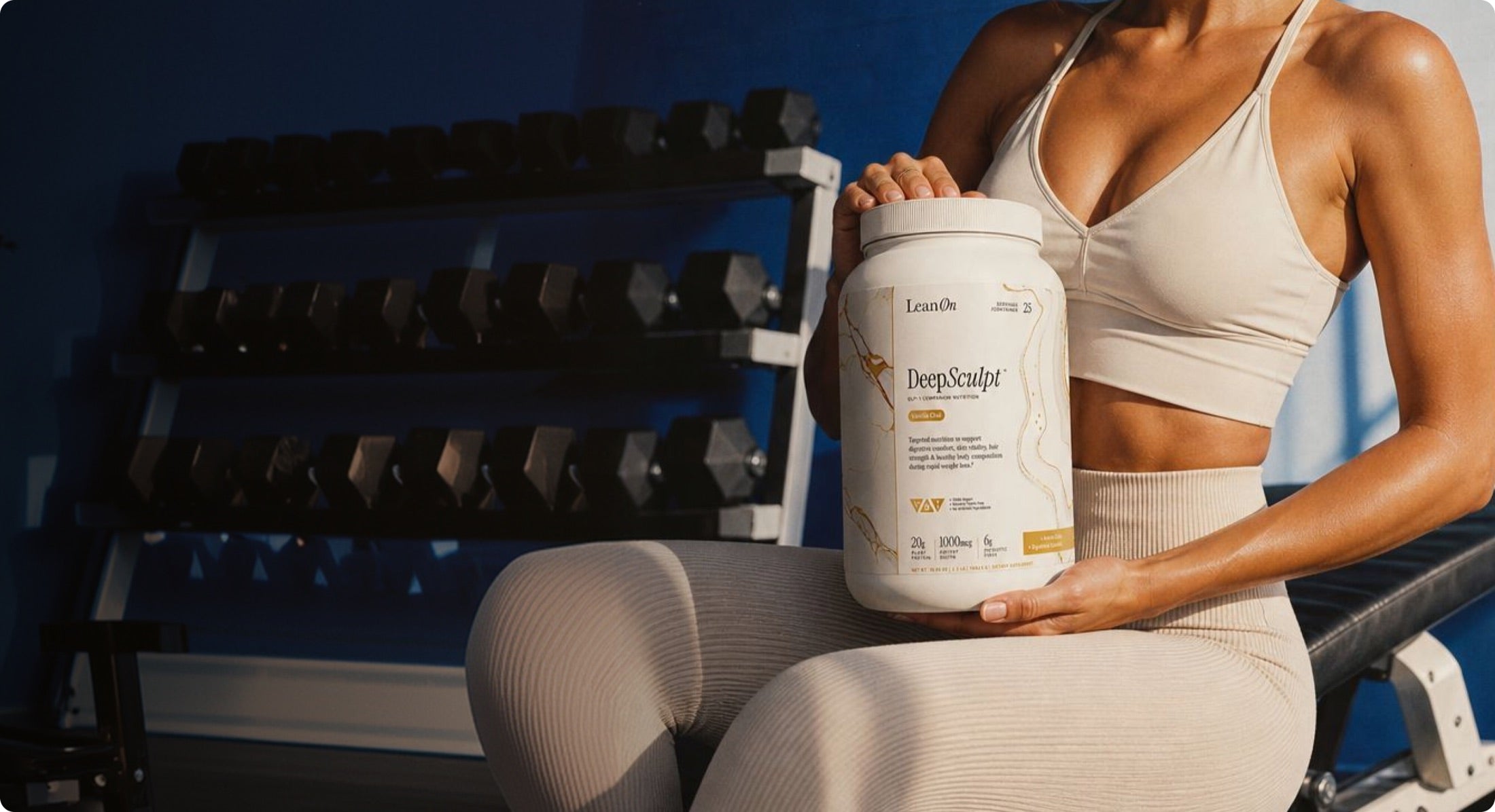 Woman holding DeepSculpt after a workout
